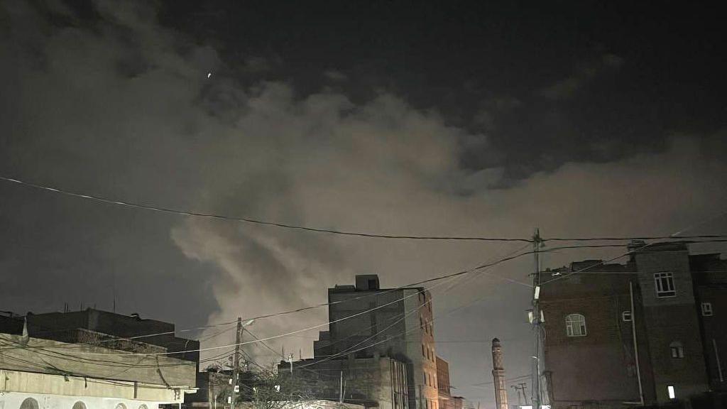 Smoke rises after the American-Israeli aircraft launched a series of airstrikes on the capital, Sanaa, Yemen on March 15, 2025. 