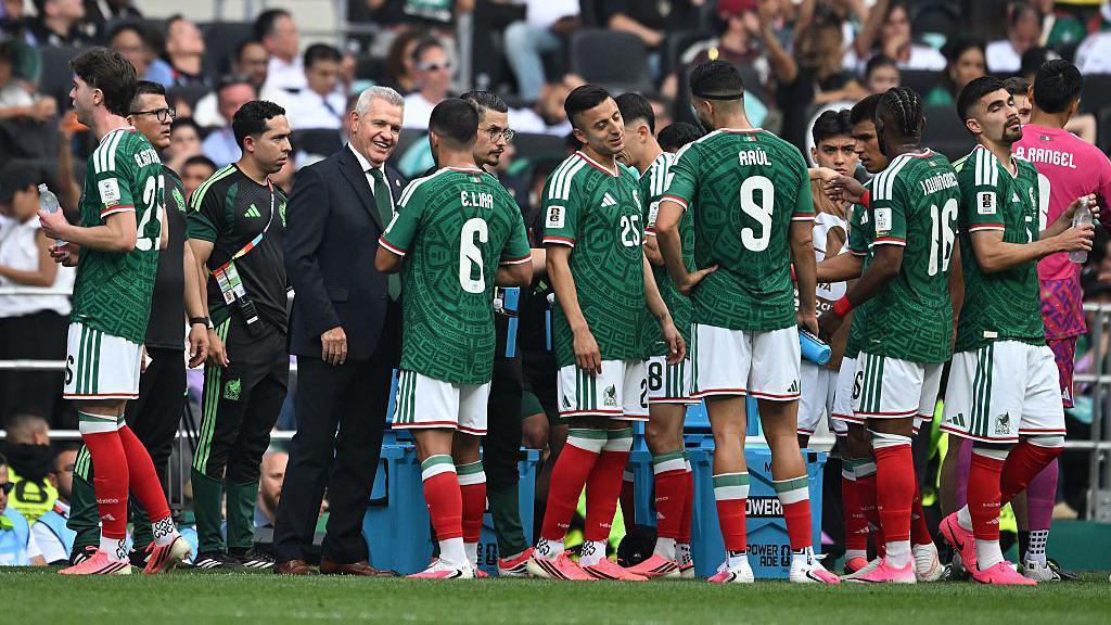 Mexico players drink near the touchline during the hydration break in the opening World Cup 2026 match against South Africa