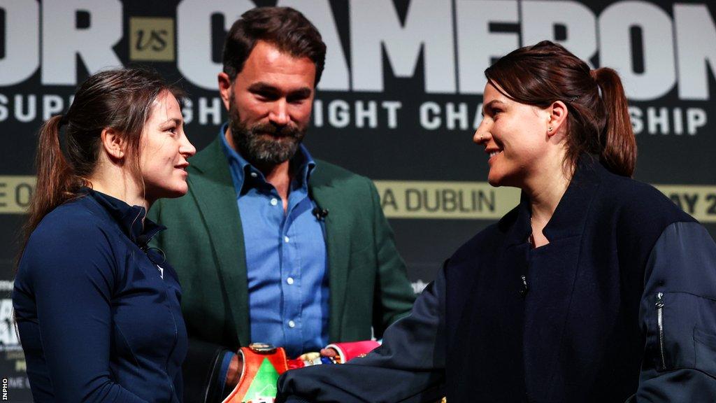 Katie Taylor and Chantelle Cameron with fight promoter Eddie Hearn