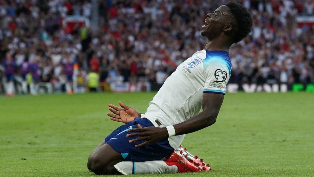 England's Bukayo Saka celebrates scoring their side's fifth goal of the game of the game, completing his hat-trick during the UEFA Euro 2024 Qualifying Group C match at Old Trafford