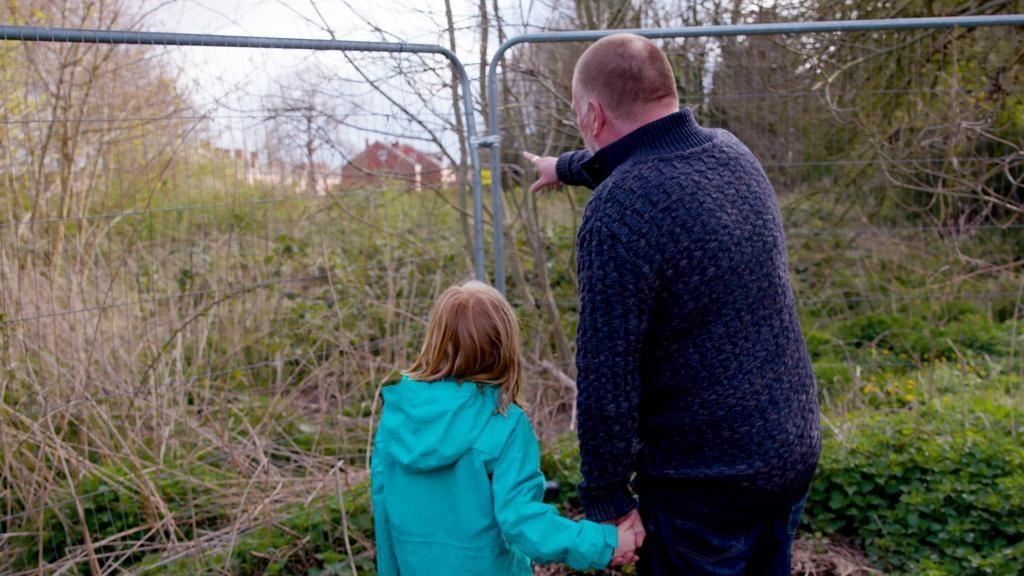 Man and girl looking at the site in Greenfields, Shrewsbury