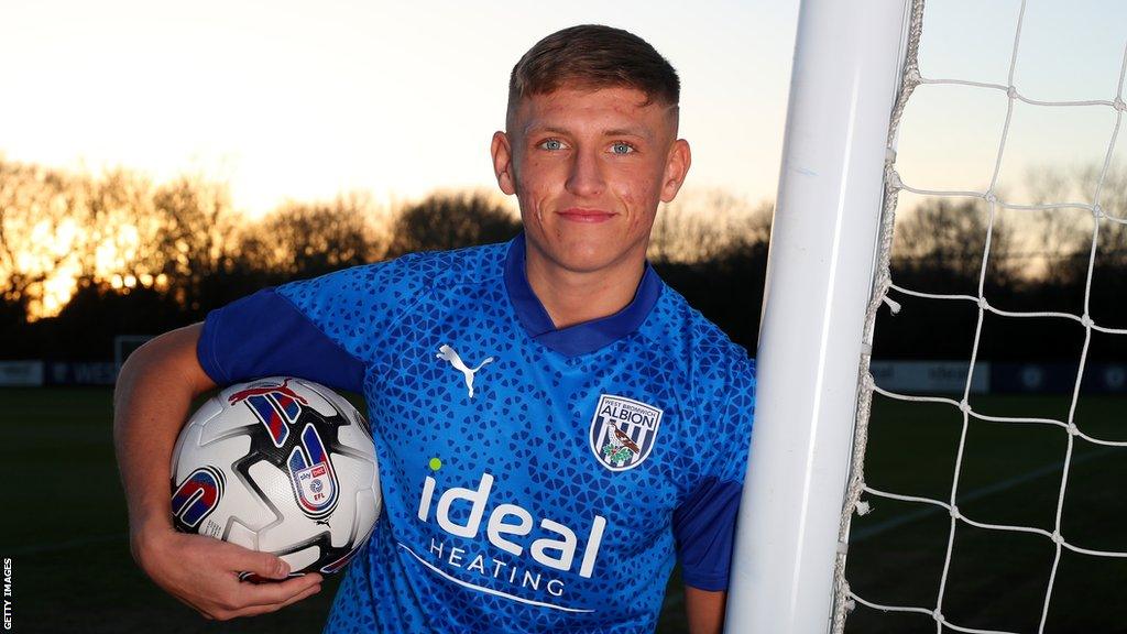 Callum Marshall poses with a ball