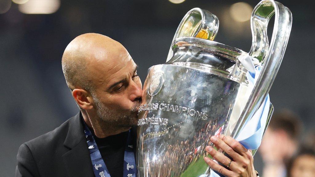 Pep Guardiola kisses the Champions League trophy after Manchester City beat Inter Milan in Istanbul