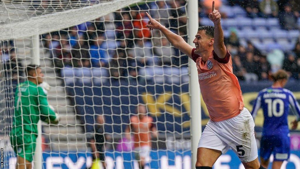 Portsmouth defender Regan Poole celebrates his goal at Wigan