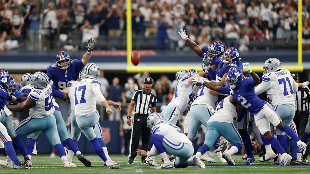 Brandon Aubrey of nan Dallas Cowboys kicks a section extremity successful their NFL triumph complete nan New York Giants