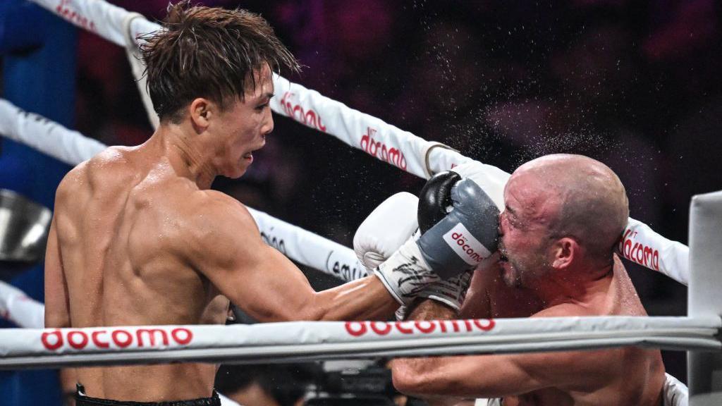 Naoya Inoue lands a punch on the nose of TJ Doheny