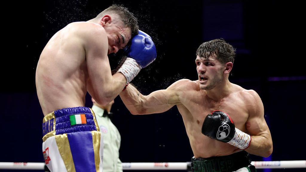 Stephen McKenna (left) and Lee Cutler (right) battle it out at the Exhibition Centre in Liverpool