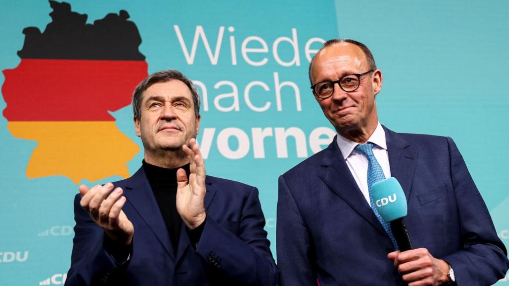 German conservative candidate for chancellor and Christian Democratic Union (CDU) party leader Friedrich Merz stands next to Bavarian state premier and leader of the Christian Social Union (CSU) Markus Soeder