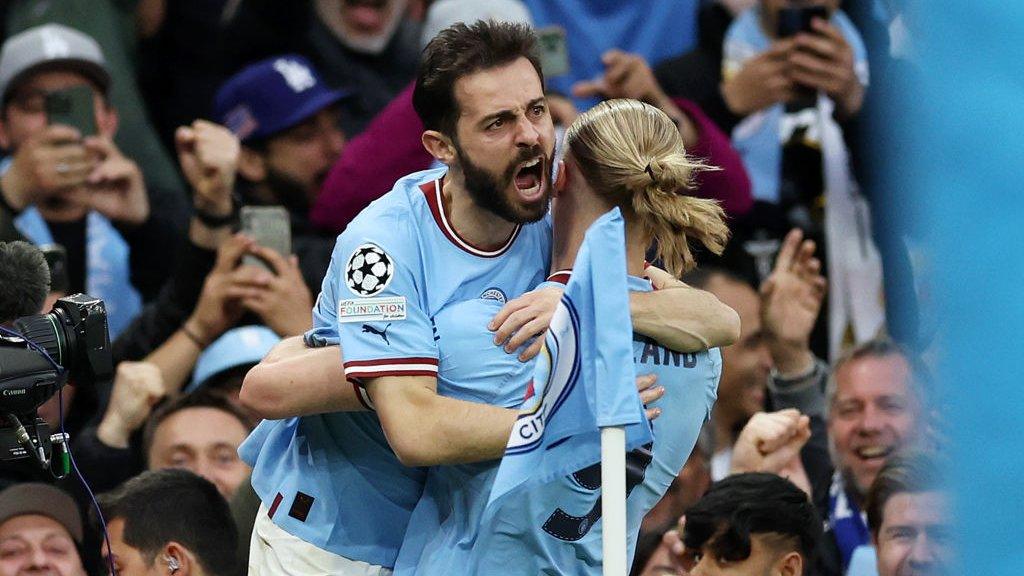 Bernardo Silva and Erling Haaland celebrate