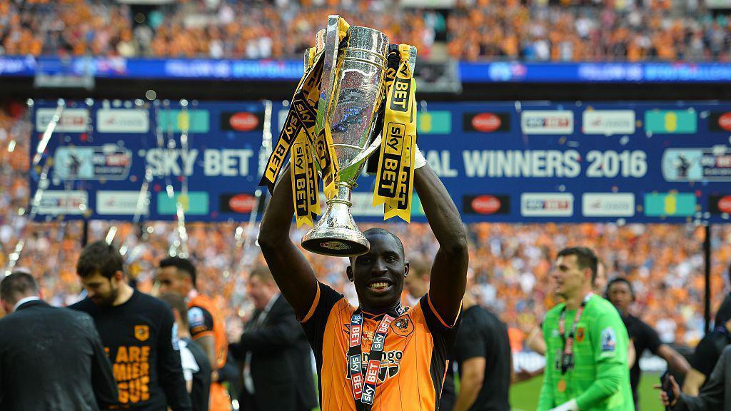 Mohamed Diame holding the Championship play-off trophy
