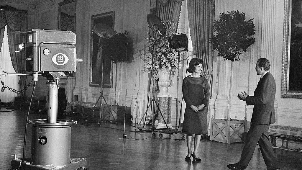 CBS News correspondent Charles Collingwood speaks with American First Lady Jacqueline Kennedy in the East Room of the White House