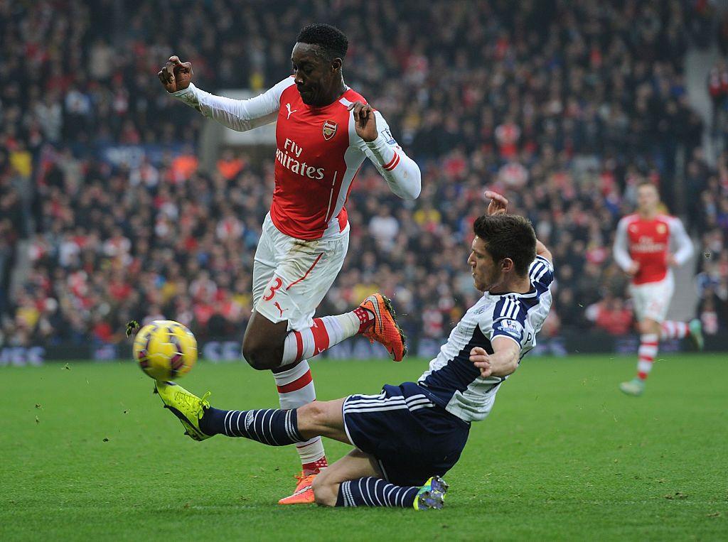 Danny Welbeck of Arsenal tackled by Sebastien Pocognoli of West Brom during the Barclays Premier League match between West Bromwich Albion and Arsenal.