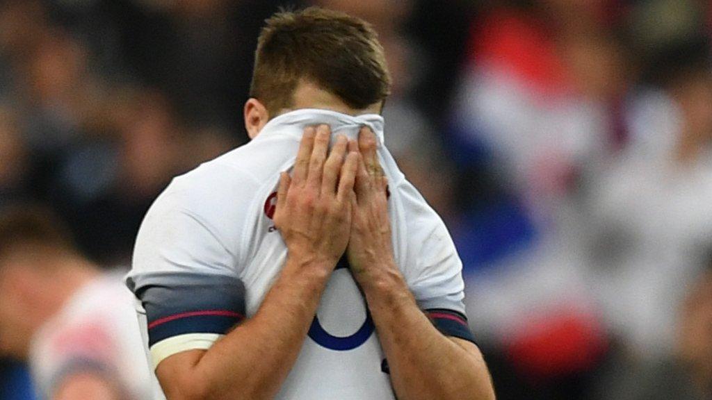 England scrum-half Richard Wigglesworth covers his face with his shirt in disappointment after the loss to France on Saturday