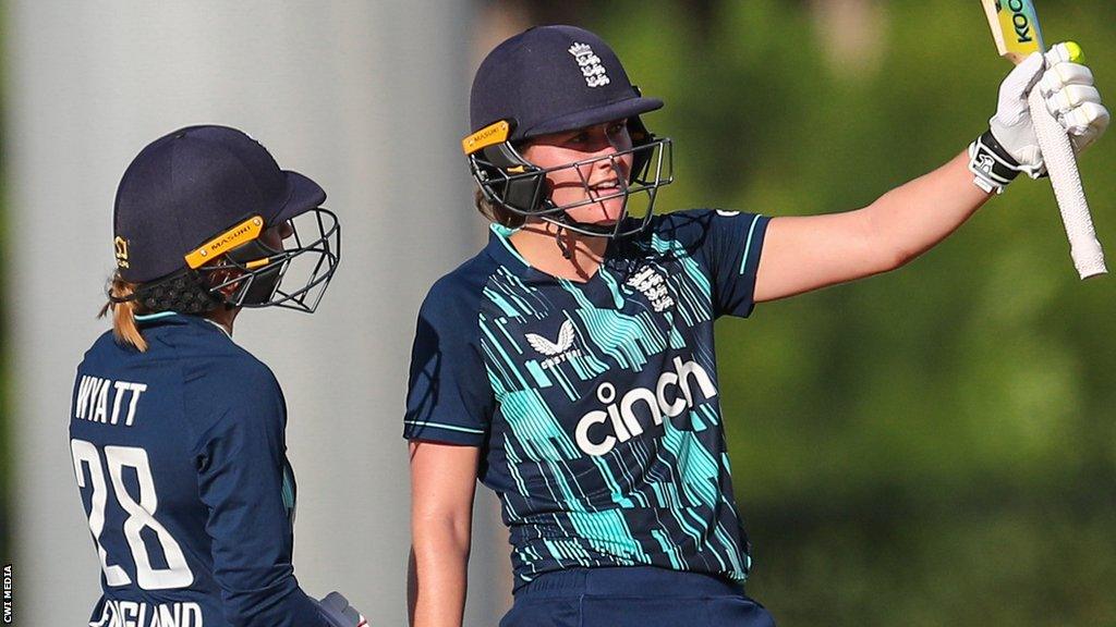 England all-rounder Nat Sciver raises her bat after hitting fifty against West Indies