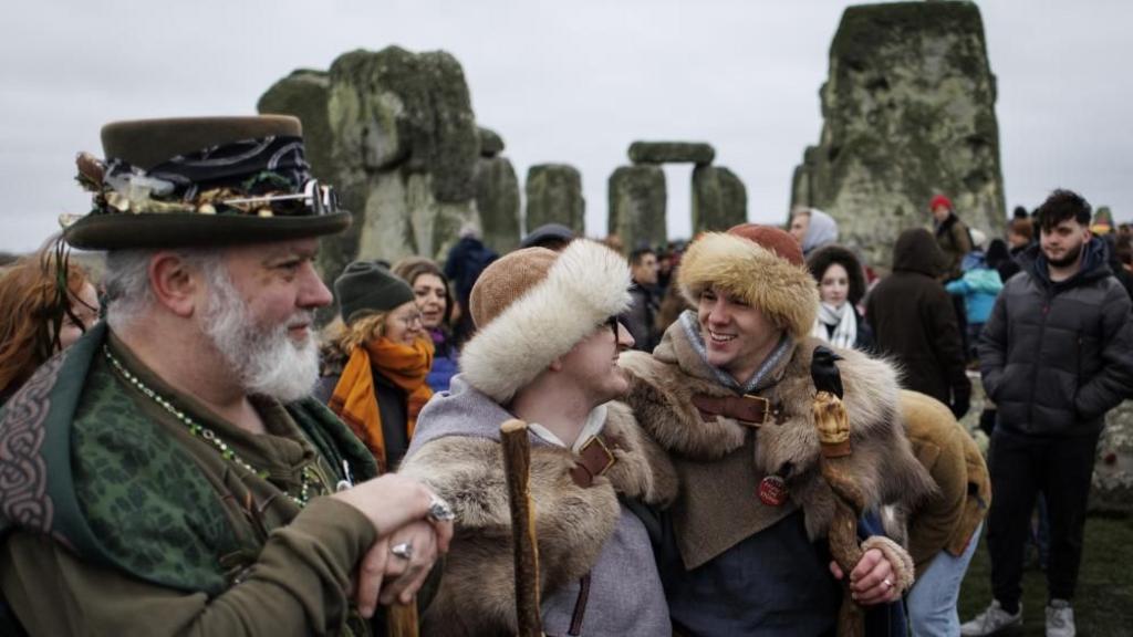 Revellers take part in the winter solstice celebrations at the ancient Stonehenge monument in Wiltshire, Britain