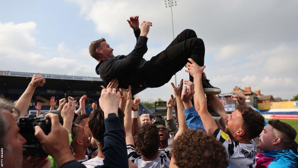 Rob Edwards celebrating winning promotion with Forest Green Rovers