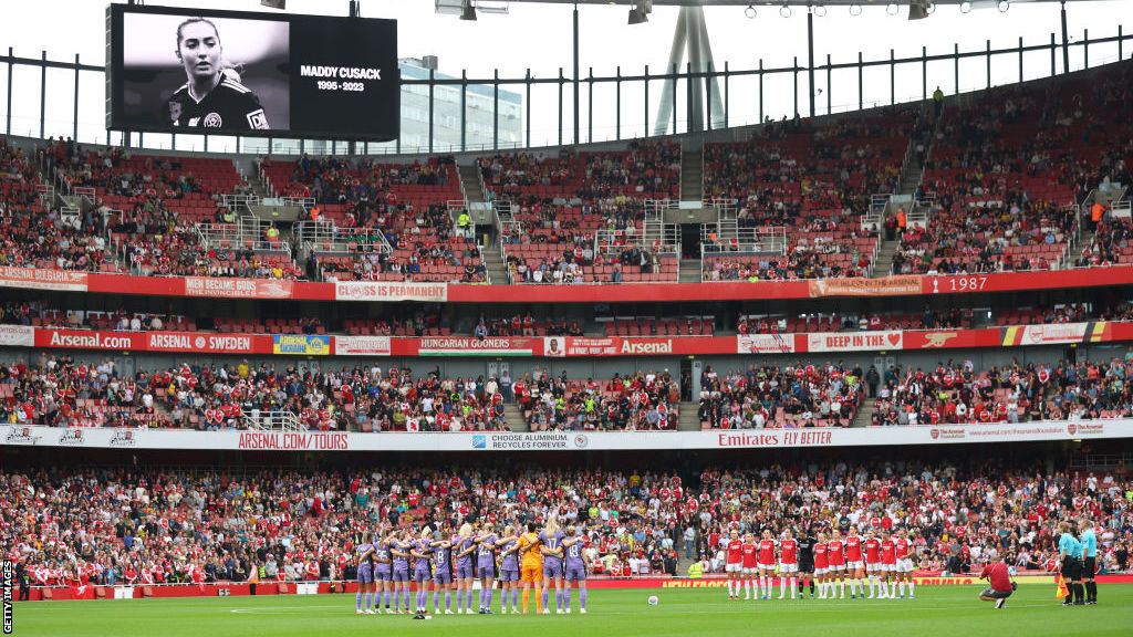 An image of Maddy Cusack with the words 'Maddy Cusack 1995-2023' is displayed on the big screen at Emirates Stadium prior to Arsenal v Liverpool in the Women's Super League