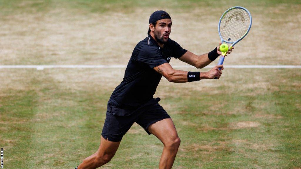 Matteo Berrettini plays a backhand