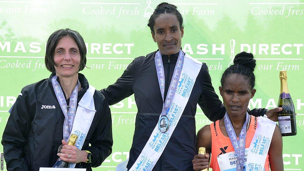 On the Belfast Marathon podium are runner-up Gladys Ganiel, winner Shewaye Woldemeskel and third-placed finisher Gadise Negasa