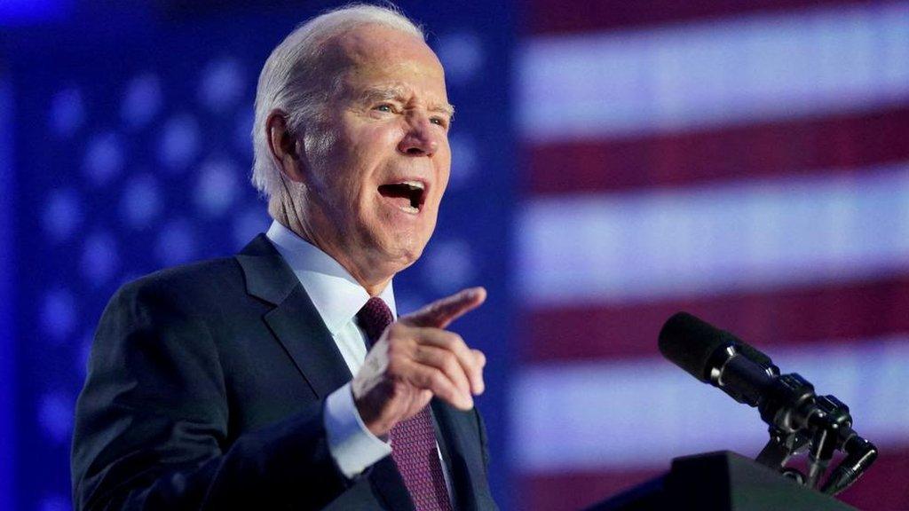 Joe Biden speaks at a podium