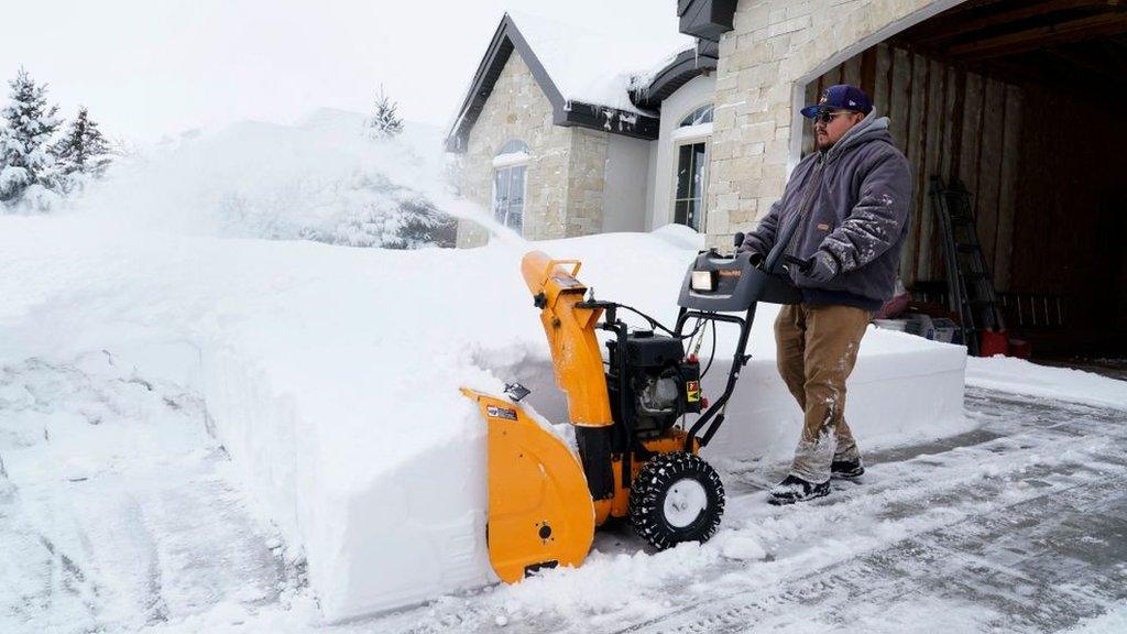 A man removing snow in Utah