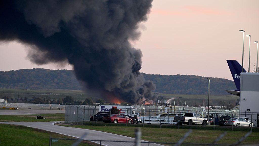 At least three dead after cargo plane crashes at Kentucky airport, as  flames engulf businesses - follow live - BBC News