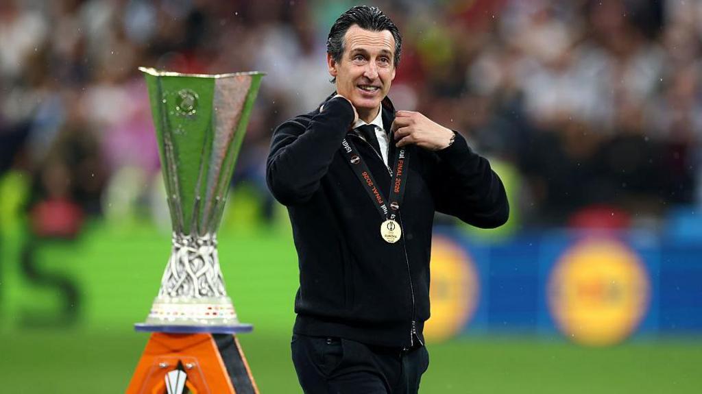 Aston Villa manager Unai Emery and the Europa League trophy