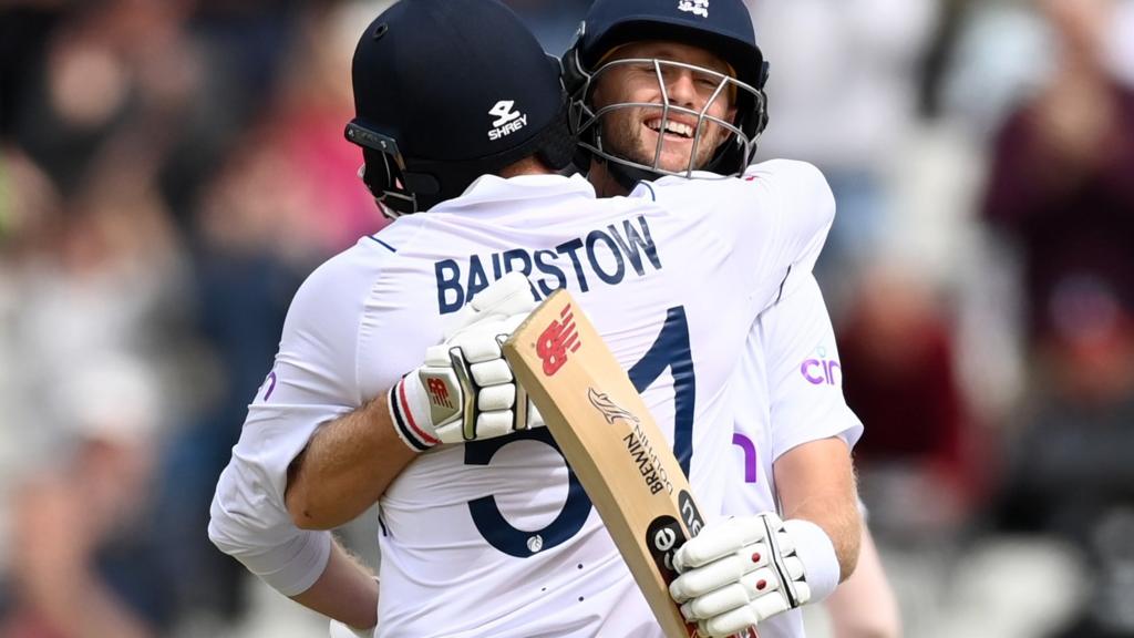 England batters Jonny Bairstow and Joe Root embrace