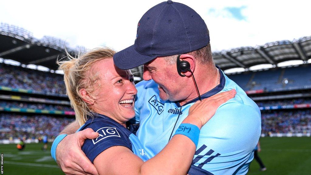 Dublin captain Carla Rowe celebrates with manager Mick Bohan after Sunday's triumph at Croke Park