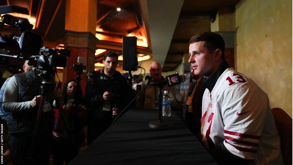 Brock Purdy talks to the media