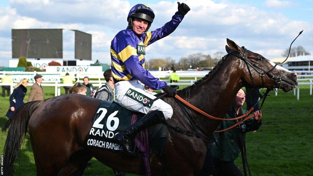 Derek Fox celebrates on board the 2023 Grand National winner Corach Rambler