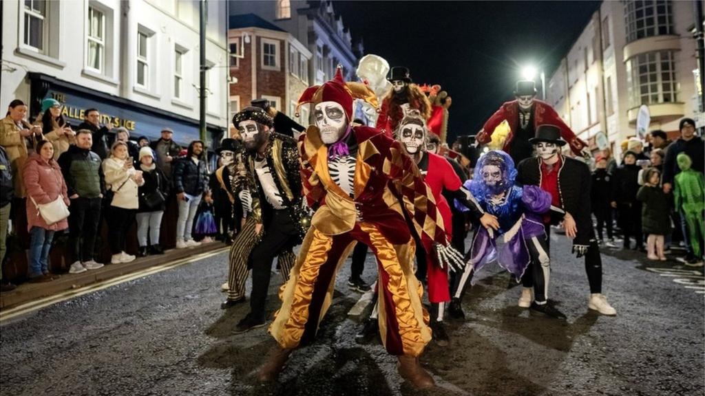 A crowd of performers in Derry