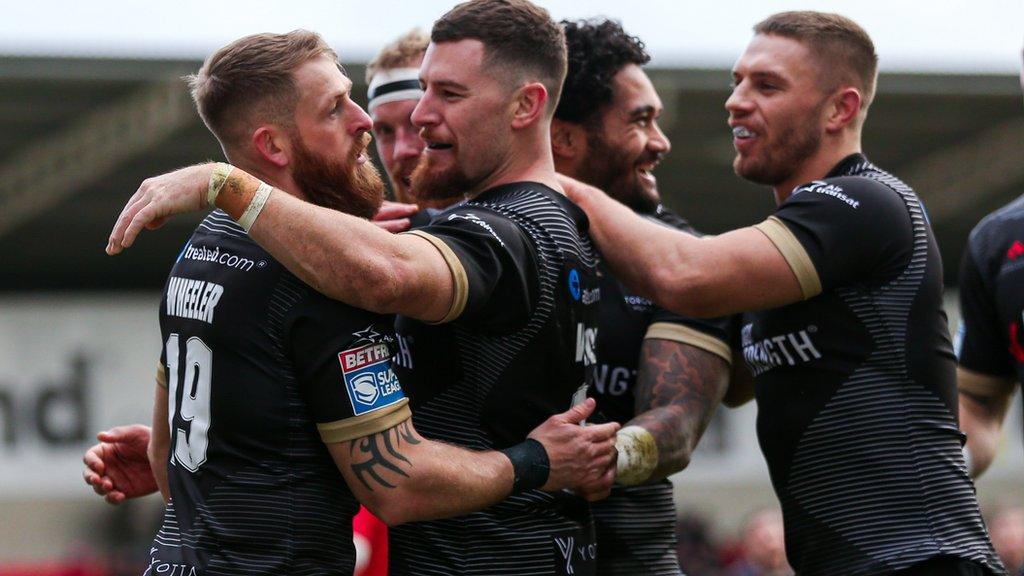 Toronto Wolfpack players celebrate a try