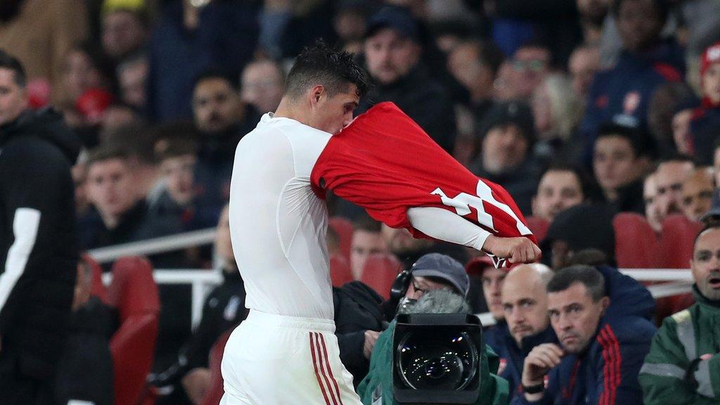 Granit Xhaka takes off his Arsenal as he angrily walks off the pitch against Crystal Palace