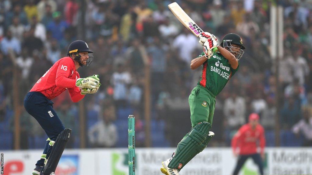 Najmul Hossain Shanto batting as England wicketkeeper Jos Buttler watches on