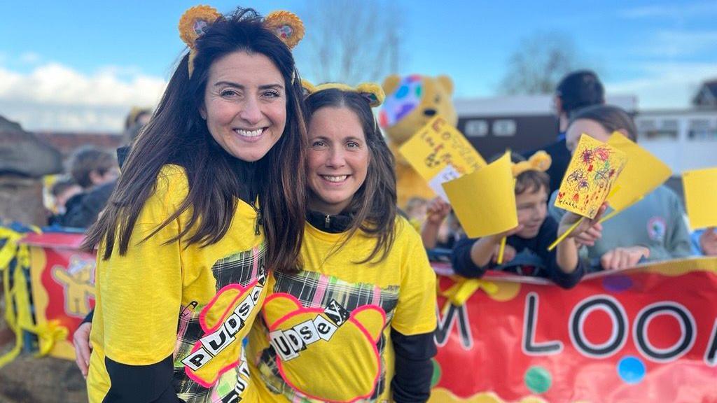 Amy Garcia and Lindsey Burrow smile and look at the camera 