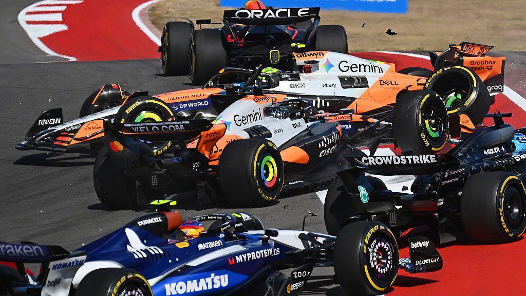 Oscar Piastri and Lando Norris collide at the first corner in the US Grand Prix sprint race