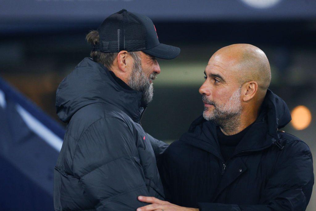 Liverpool manager Jurgen Klopp interacts with Manchester City manager Pep Guardiola during the Carabao Cup Fourth Round match between Manchester City and Liverpool at Etihad Stadium on December 22, 2022