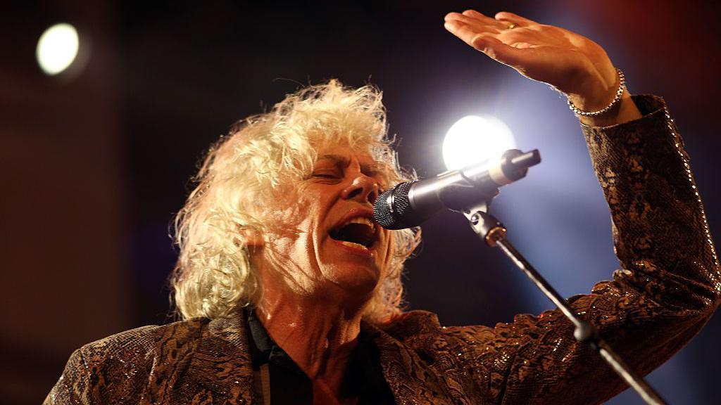 Bob Geldof of The Boomtown Rats sings in to a microphone at Weyfest Festival on August 21, 2016 