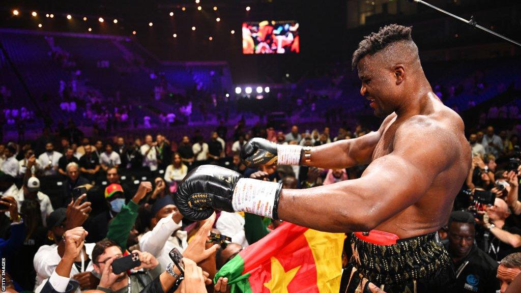 Francis Ngannou celebrates with his family at ringside