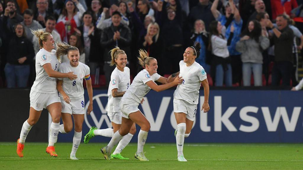 England's Lucy Bronze (right) celebrates with her team-mates after scoring her side's second goal during the UEFA Women's Euro England 2022 Semi Final match between England and Sweden