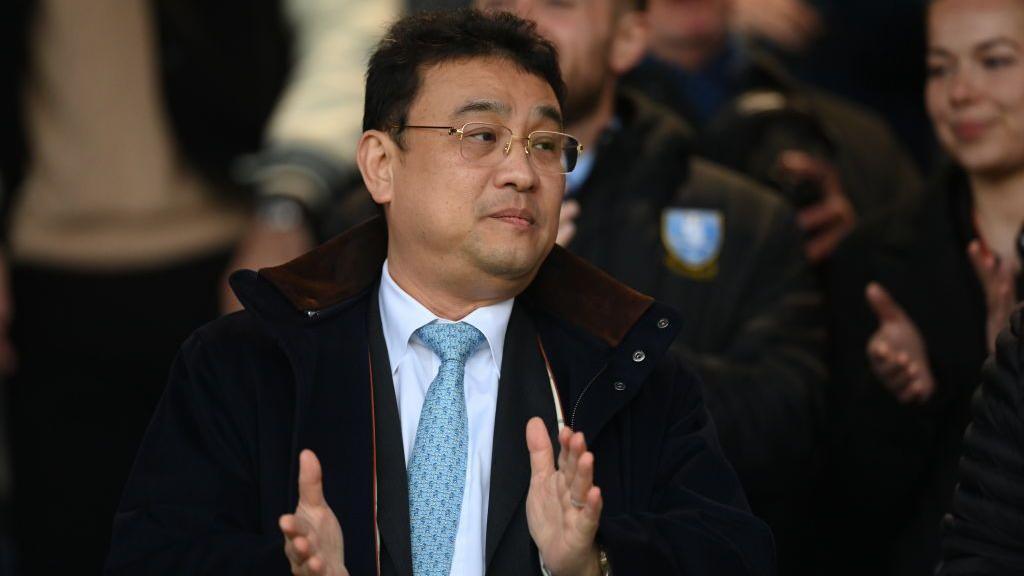 Dejphon Chansiri claps during a Sheffield Wednesday fixture in the Championship