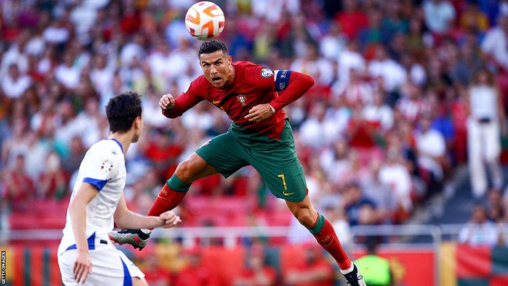 Cristiano Ronaldo heads the ball for Portugal