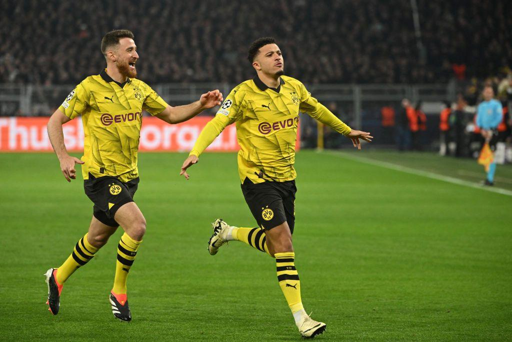 Jadon Sancho celebrates his goal v PSV Eindhoven with teammate Salih Ozcan