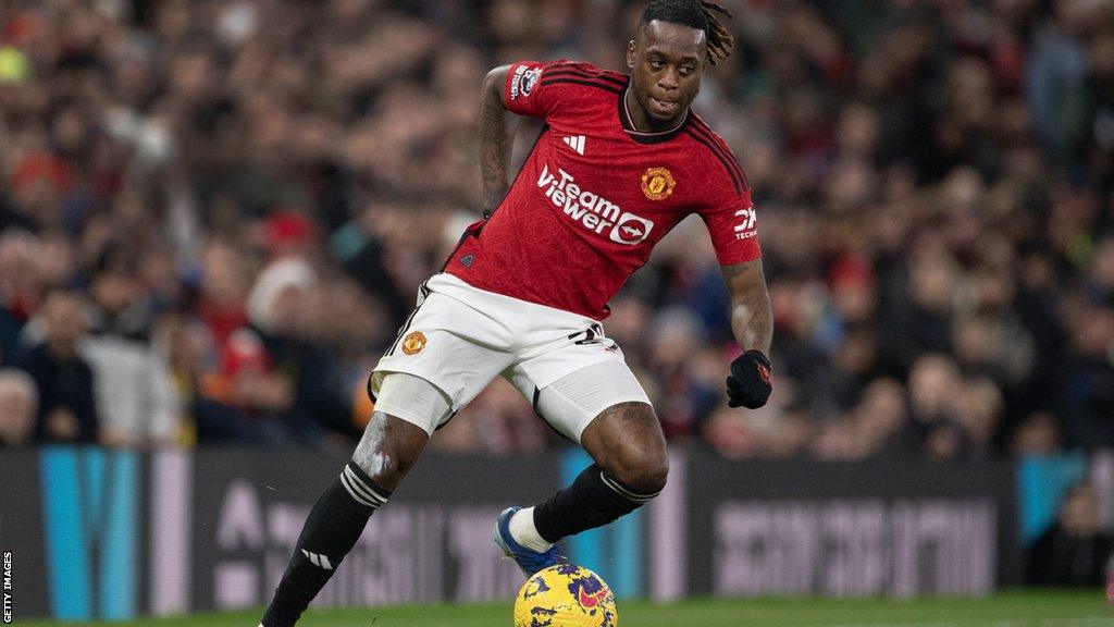 Manchester United defender Aaron Wan-Bissaka with the ball at his feet