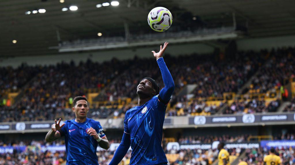 Noni Madueke of Chelsea celebrates scoring his team's fifth goal and completing his hat trick during the Premier League match between Wolverhampton Wanderers FC and Chelsea FC at Molineux