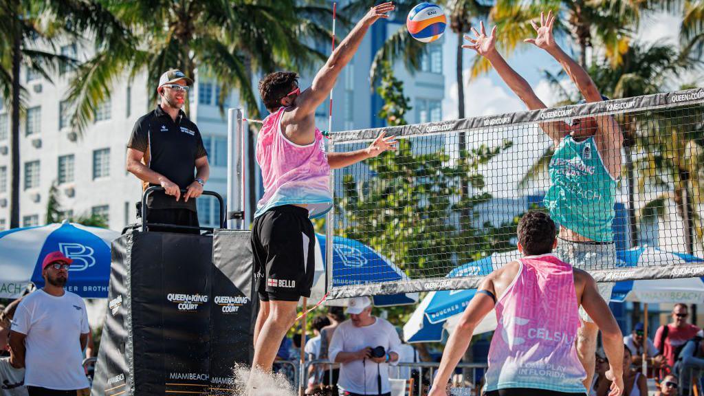 Javier Bello spikes the ball 