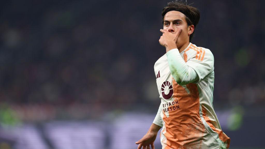 Paulo Dybala celebrates scoring for Roma against AC Milan.