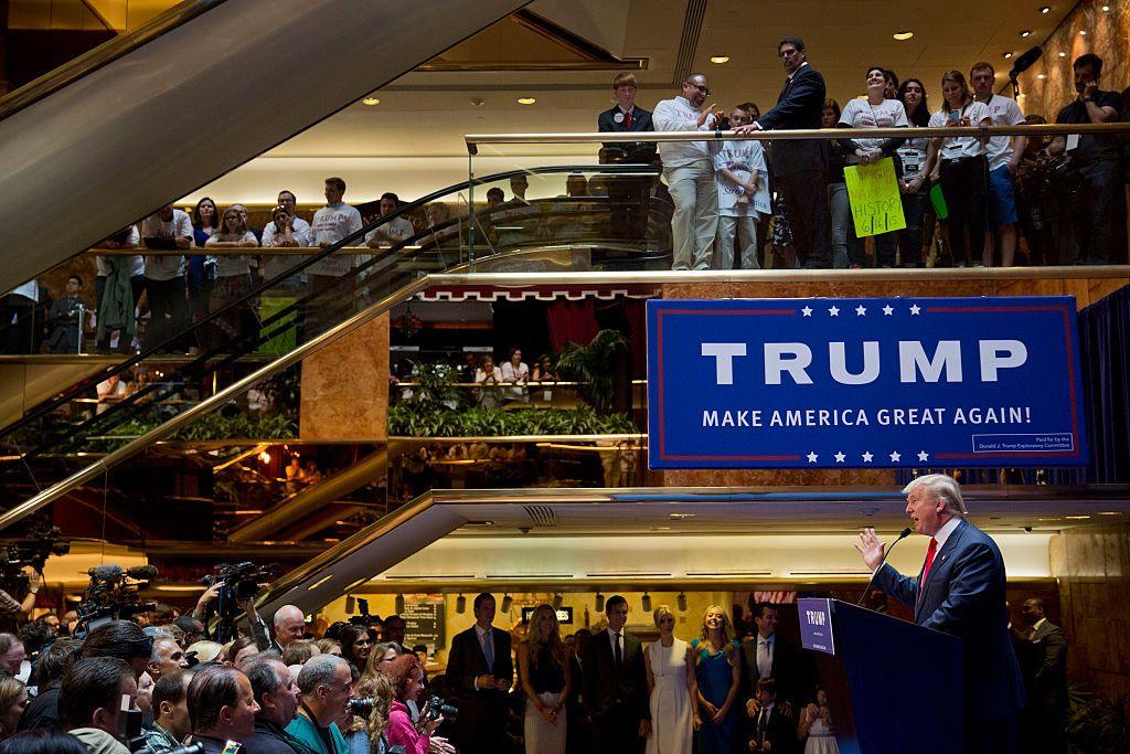 Trump speaks at Trump Tower in New York beneath a blue banner saying Make America Great Again. He announces he will seek the 2016 Republican presidential nomination, as his family watch from the sidelines.