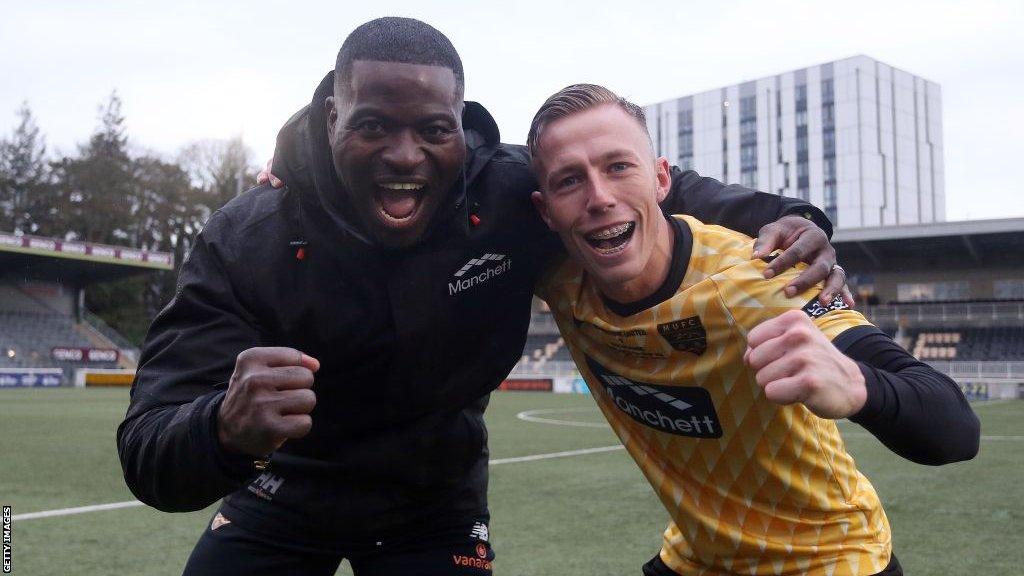 George Elokobi (left) and Sam Corne celebrates Maidstone United's FA Cup win